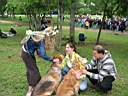 01_0020.JPG: Eeyore's Birthday 2004:  Katie, Liz & PJ petting Eeyore dogs